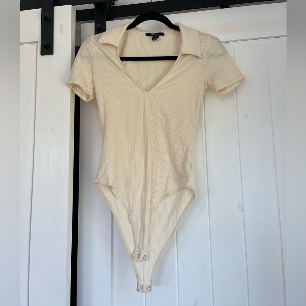 Forever 21 cream/off white short sleeved collared bodysuit size small